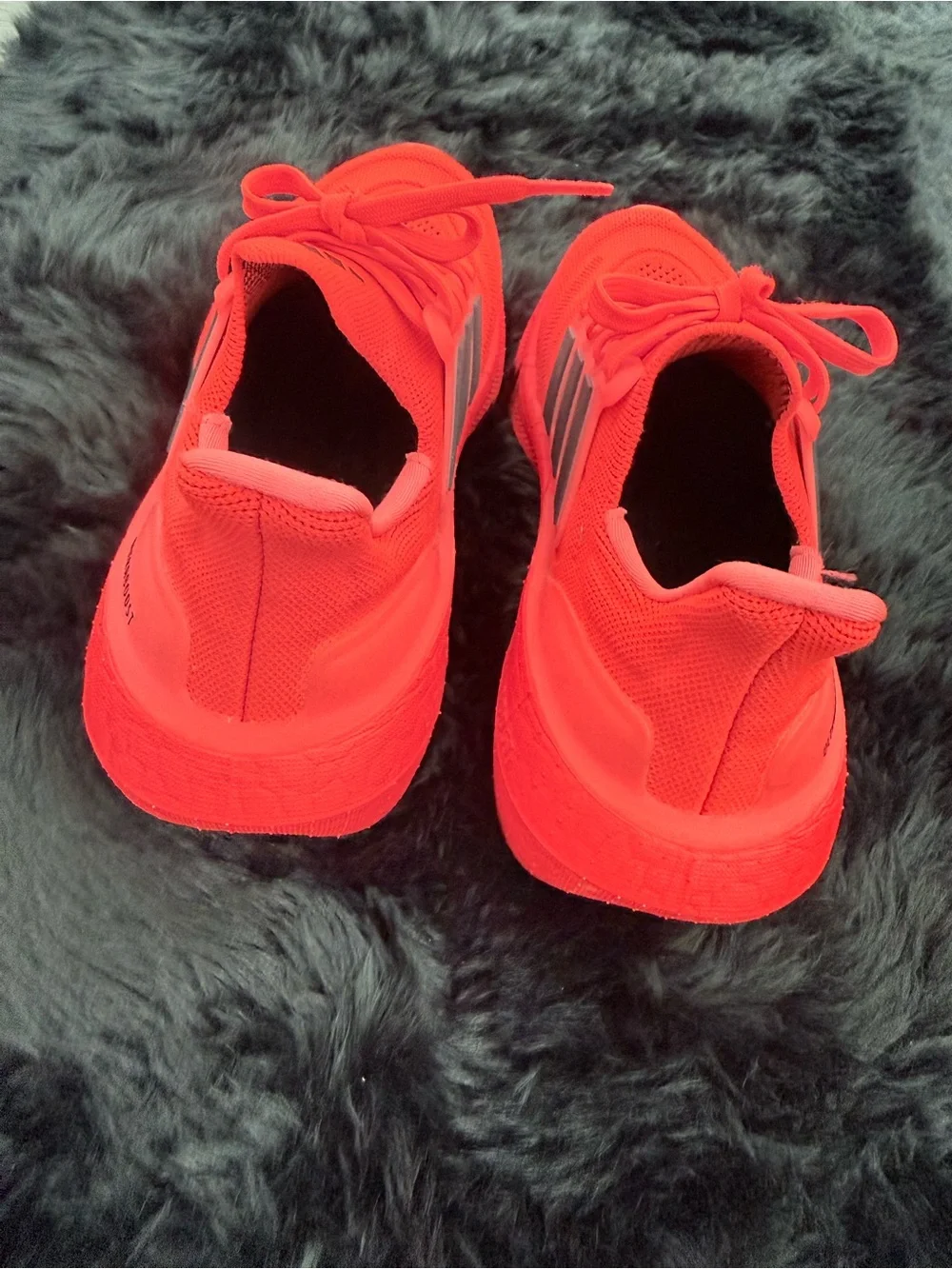 adidas red orange Ultraboost Running Sneakers.